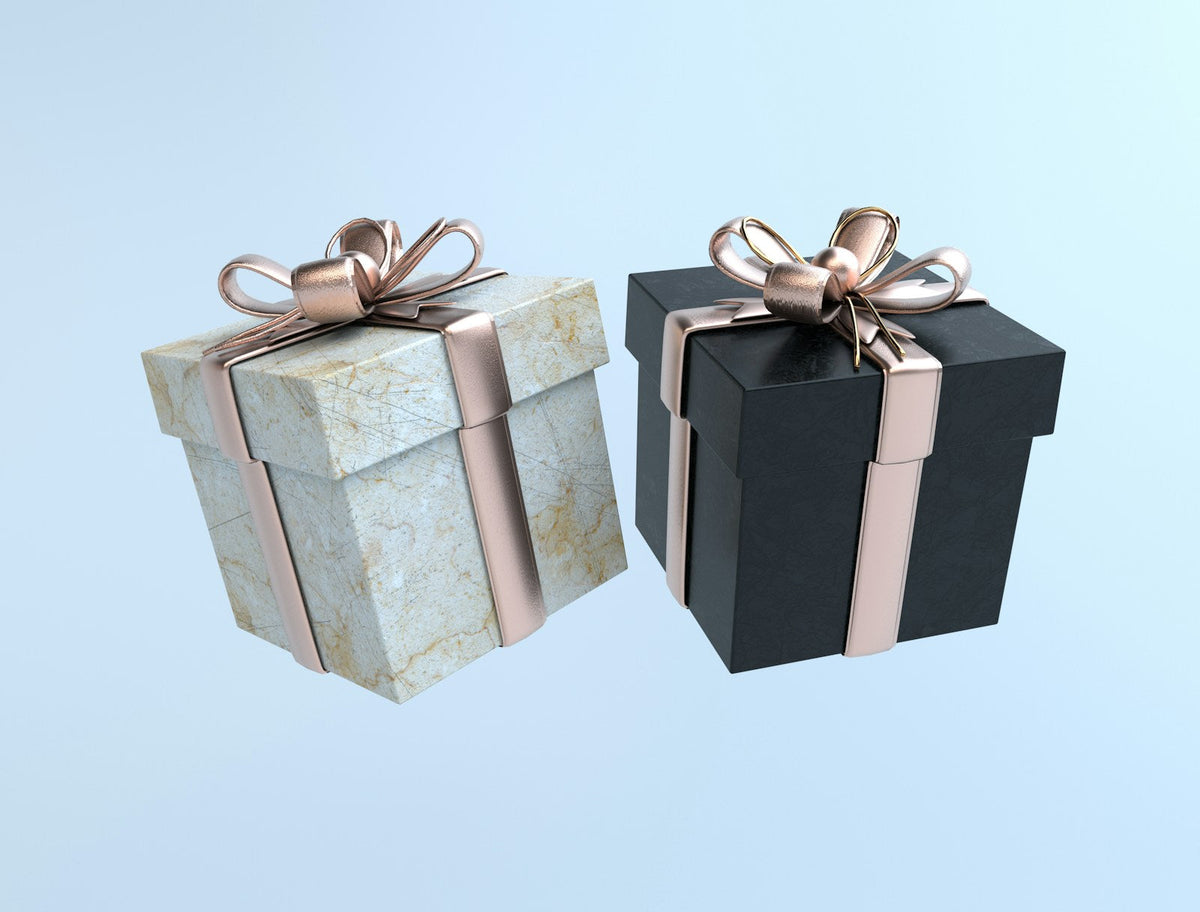 Cajas de regalo con moño dorado